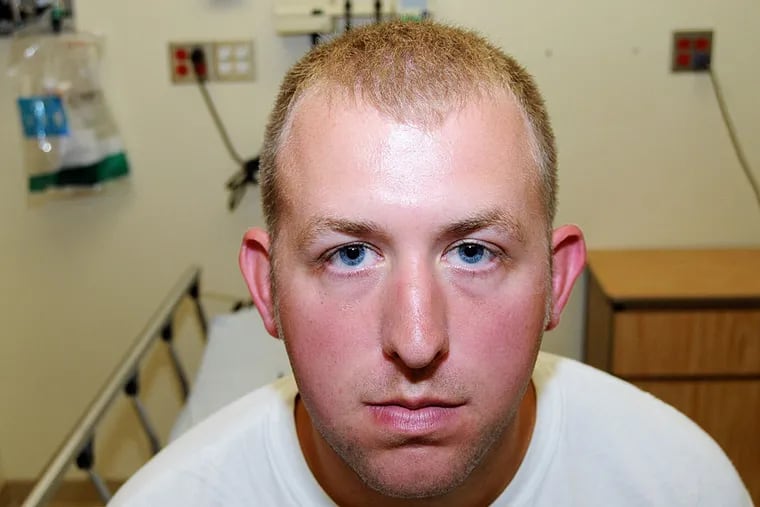 Former Ferguson police officer Darren Wilson poses in an evidence photo at the hospital, on the same day that he fatally shot Michael Brown, on August 9, 2014 in Ferguson, Missouri.