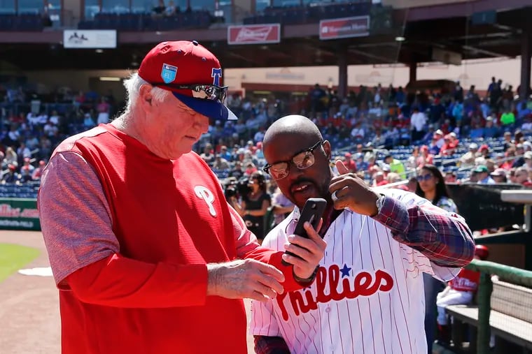 Jimmy Rollins, right, and Charlie Manuel together at a Phillies spring training game in 2018.