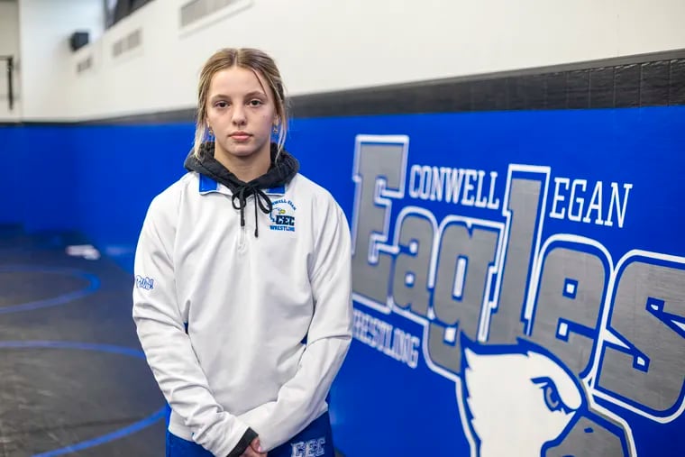 Julia Horger, 16, of Bensalem, is a sophomore at Conwell-Egan. She poses for a portrait in the schools wrestling gym at Fairless Hills on April 10.