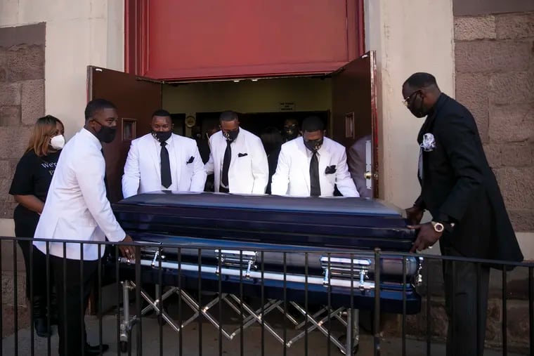 The casket of Walter Wallace Jr. is carried out of the National Temple Baptist Church in Philadelphia on Saturday. Wallace was shot and killed by Philadelphia police on Oct. 26.