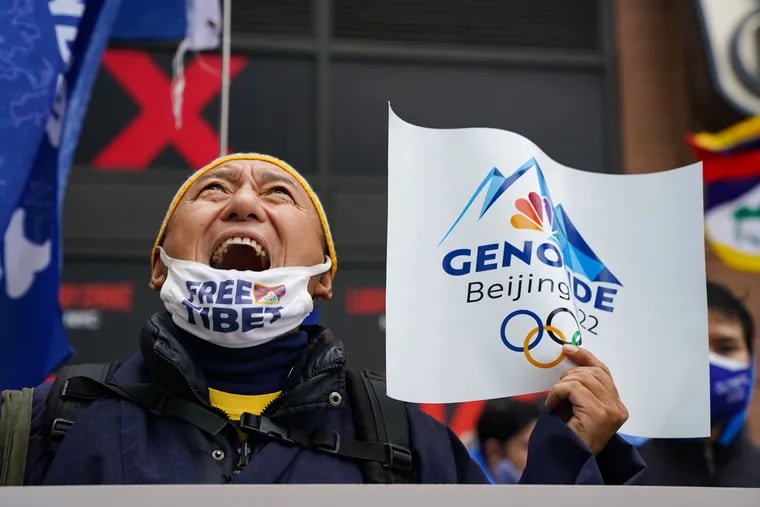 Thupten Chonyi, former president of the Tibetan Association of Philadelphia, chants outside the People's Republic of China consulate during a protest Thursday in New York against China’s hosting of the 2022 Winter Olympics. The protest is part of an effort to call out U.S. companies for supporting an Olympic Games that is taking place in a country with a history of human rights violations.