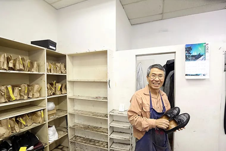 Owner Wan Song of Superior Shoe Repair, 138 S. 15th Street which is closing today, Dec. 31, 2014, after 32 years.  ( DAVID SWANSON / Staff Photographer )