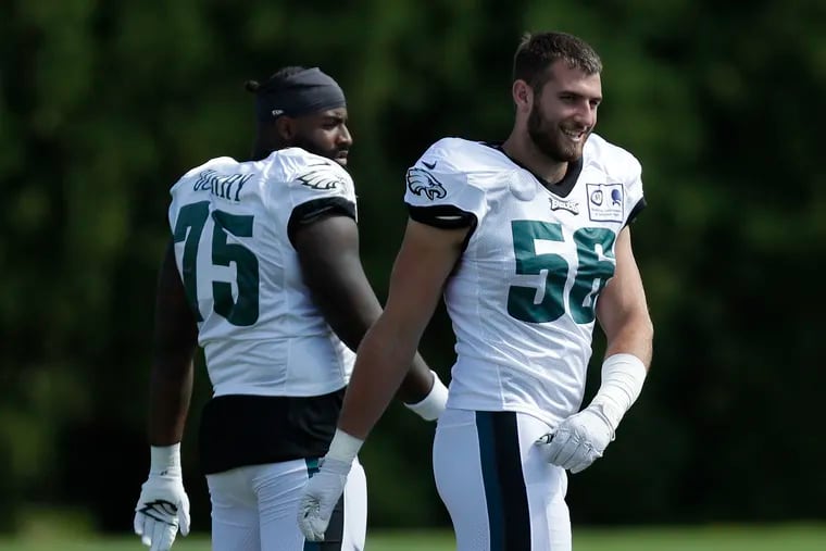 Eagles defensive end Casey Toohill (right) with teammate Vinny Curry before the start of training camp on Aug. 24.