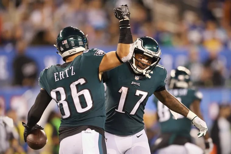 Eagles tight end Zach Ertz (86) and wide receiver Alshon Jeffery (17) celebrate after Ertz scored a touchdown in the second quarter against the Giants on Thursday.