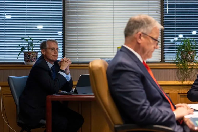 PSERS Investment Head James H. Grossman Jr., (left) listens in during the main board room meeting at the PSERS offices in Harrisburg, Pa., on Friday, June 11, 2021.