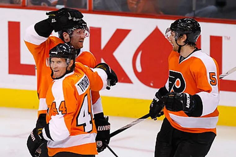 Scott Hartnell (back left) scored two of the Flyers' three goals in last night's win. (Yong Kim/Staff Photographer)
