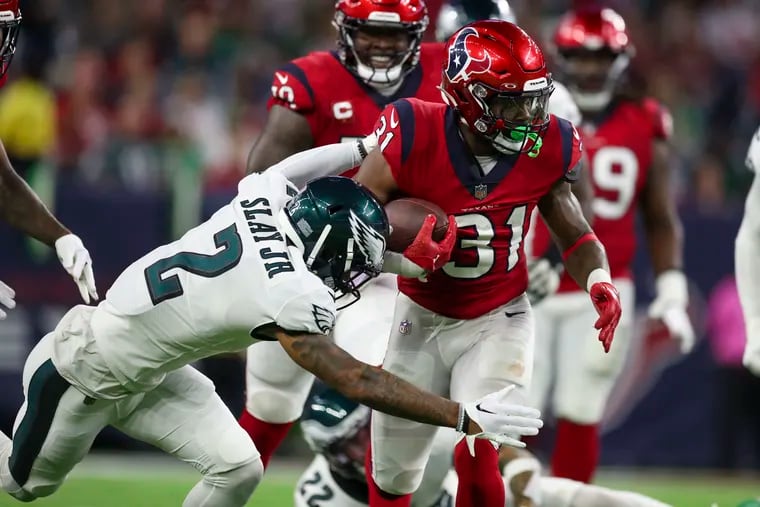 Eagles cornerback Darius Slay misses a tackle on Houston Texans running back Dameon Pierce during their Thursday night game last week.