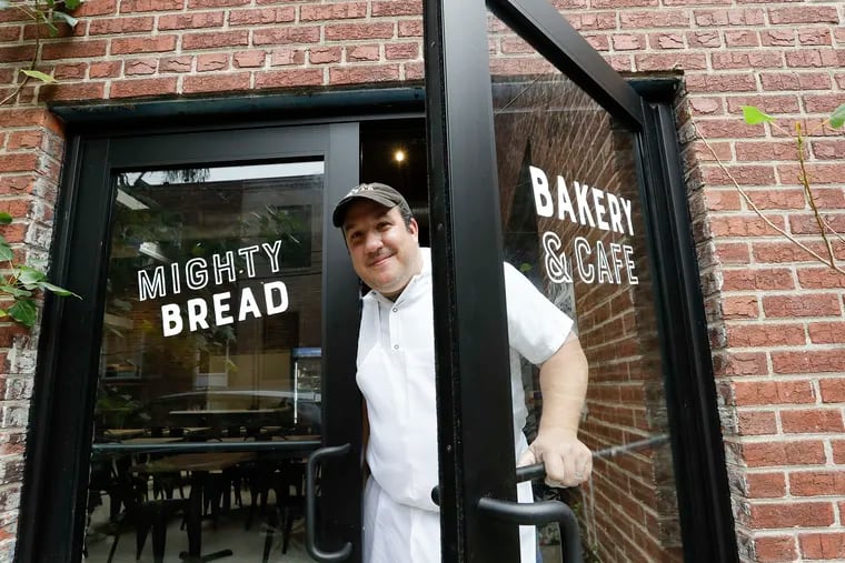 Chris DiPiazza, Owner and Founder of the Mighty Bread Bakery & Cafe in South Philadelphia at the front door on Friday, October 29, 2021.