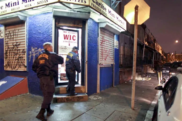 Police investigate the murder of Reina Aguirre Alonso in January 2012 at the corner of Westmoreland and Mutter streets in North Philly.