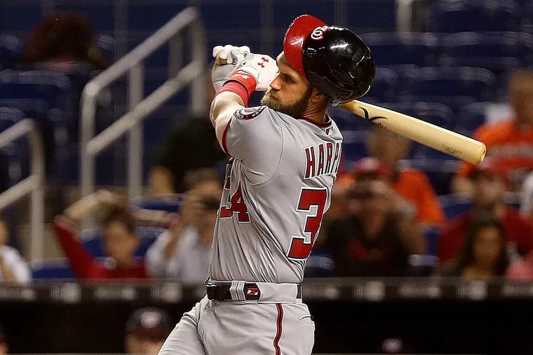 Bryce Harper losing his helmet while batting against the Miami Marlins in September.
