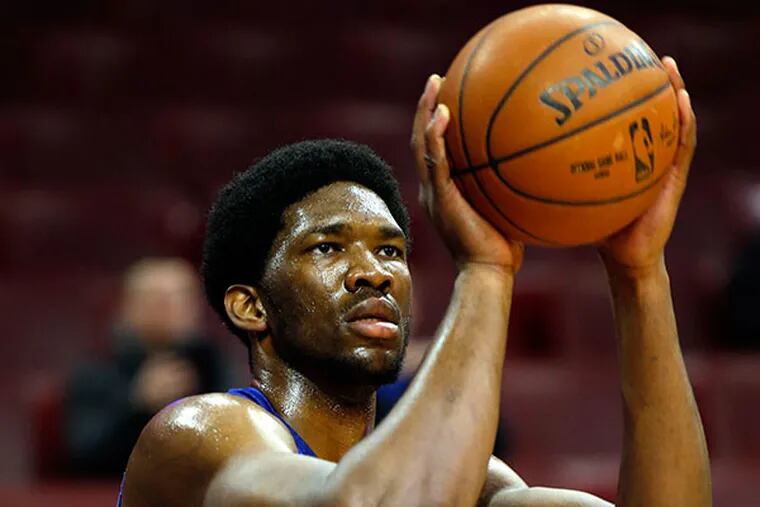 The Sixers' Joel Embiid shoots the ball during warm ups before the Sixers' game against the Utah Jazz on Friday, March 6, 2015 in Philadelphia.  (Yong Kim/ Staff Photographer)
