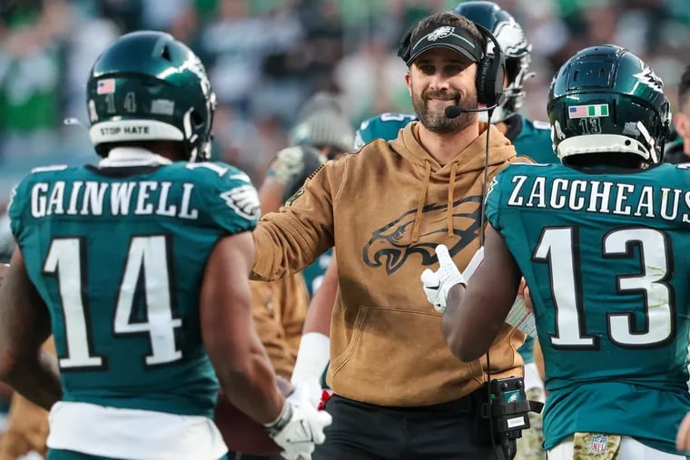 Eagles head coach Nick Sirianni greets running back Kenneth Gainwell after his first-quarter touchdown, Sunday, Nov. 5, 2023, at Lincoln Financial Field in Philadelphia.