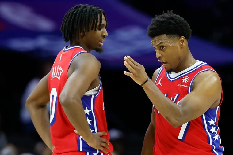 Sixers guard Kyle Lowry talks to teammate Tyrese Maxey against the Hornets on Friday.