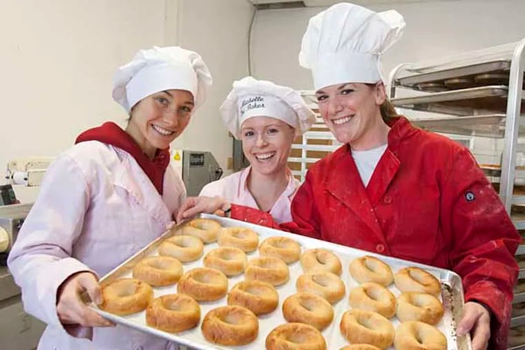 Michelle MacDonald, Brittany Nettles (center) and Alison Vandermay are the backbone of Sweet Note Bagels, a gluten-free bagel company based in Manayunk,