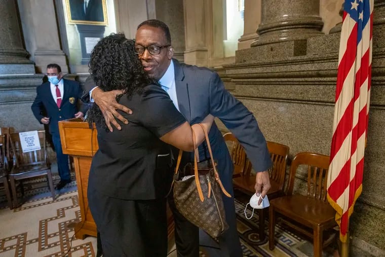 Philadelphia City Council President Darrell L. Clarke hugs Councilmember Katherine Gilmore Richardson after announcing that he will not seek reelection.