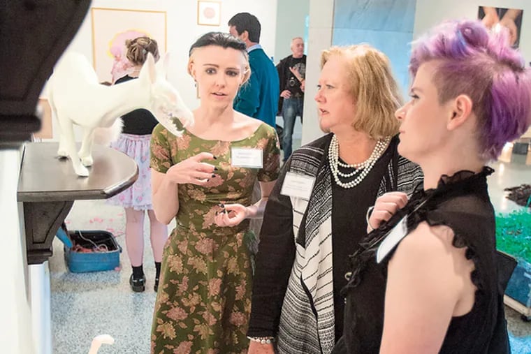 Last year's seniors Kate Blankenship (left) and Maeve Griffin, with President Cecelia Fitzgibbon, at the 2014 Senior Show last April. This is a capstone event for seniors, organized by the Locks Career Center. (Handout from the Moore College of Art)