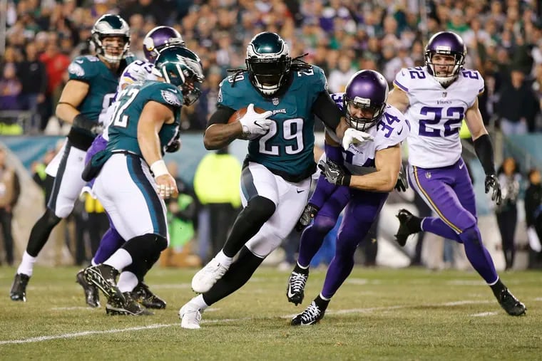 Eagles running back LeGarrette Blount runs through Andrew Sendejo (34) for a second quarter touchdown, during the 2017 NFC Championship game.