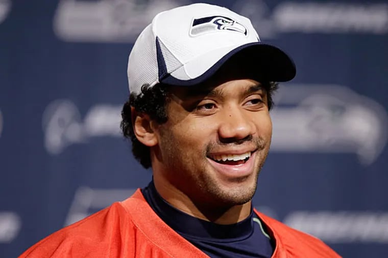 Seahawks quarterback Russell Wilson speaks at an NFL football news conference Wednesday, Jan. 22, 2014, in Renton, Wash. The Seahawks play the Denver Broncos in the Super Bowl on Feb. 2. (Elaine Thompson/AP)