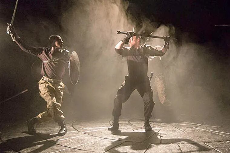 Ian Merrill Peakes as Macbeth (center) battles Jahzeer Terrell (left), Terence MacSweeny, and Sean Bradley in Arden Theatre Company's production of "Macbeth." (Mark Garvin)