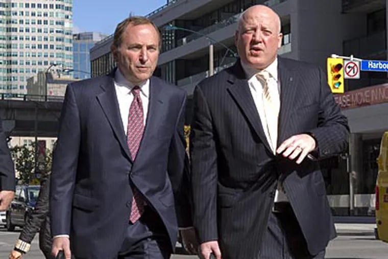 Gary Bettman and Bill Daly arrive on Tuesday as the NHL and its players resume negotiations. (Chris Young/AP/The Canadian Press)