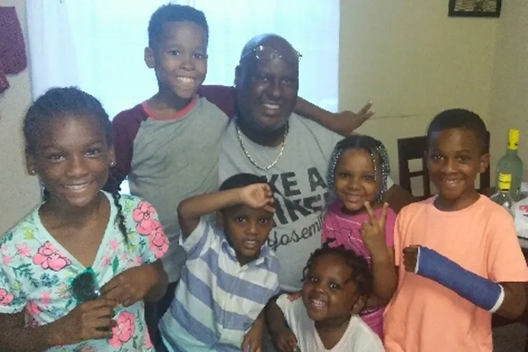 Mr. Wilkins, here with grandchildren, loved to surround himself with family and friends.