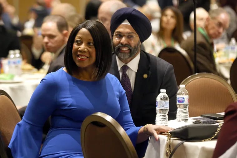 Shelia Oliver, NJ Lieutenant Governor, left, gets up to speak next to Gurbir S. Grewal, NJ Attorney General, at the New Jersey State League of Municipalities Mayor's Box Luncheon, at the Sheraton Atlantic City Convention Center Hotel, in Atlantic City, Wednesday, Nov. 13, 2018. Atlantic City Mayor Frank Gilliam did not attend the event.