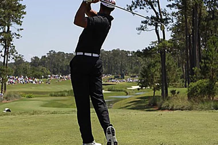 Tiger Woods hits from the fourth tee during the second round of the
Players Championship on Friday. (John Raoux/AP)