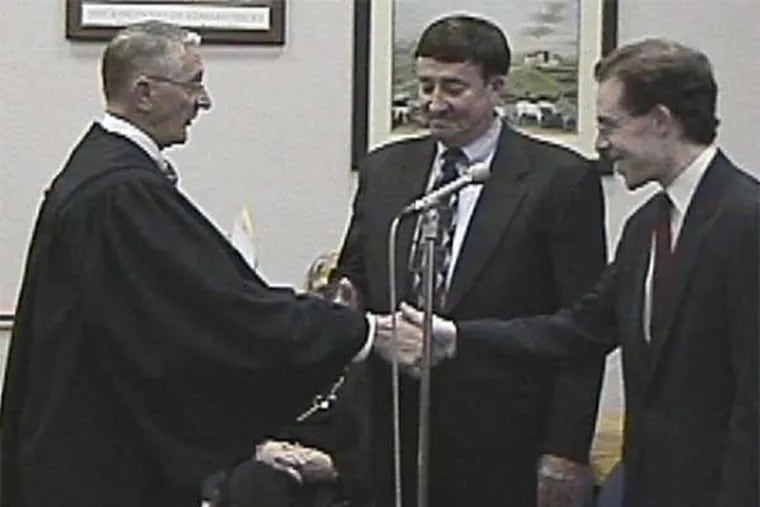Judge H. Warren Hogeland (left) in a 2002 file photo.