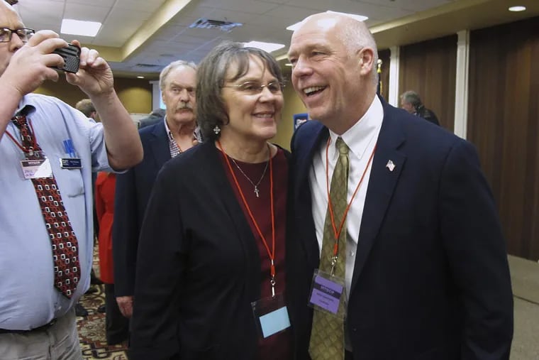 In this March 6, 2017, file photo, Greg Gianforte, right, receives congratulations from a supporter in Helena, Mont. Montana voters are heading to the polls Thursday, May 25, 2017, to decide a nationally watched congressional election amid uncertainty in Washington over President Donald Trump’s agenda and his handling of the country’s affairs.
