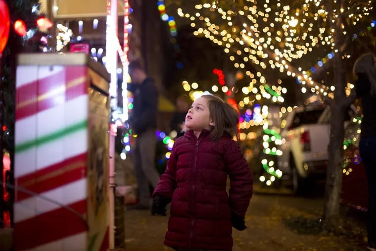 Penelope Garnant looks at the lights at &quot;Miracle on South 13th Street.&quot;