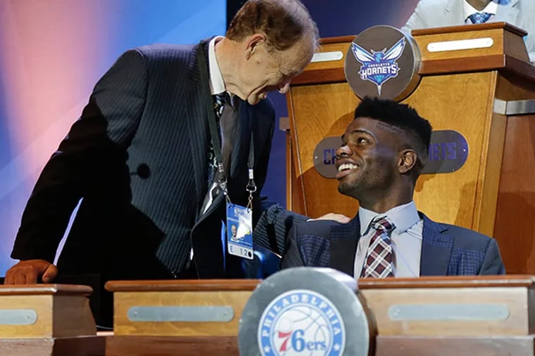 Minnesota Timberwolves owner Glen Taylor, left, talks with 76ers' Noel Nerlens before the NBA basketball draft lottery Tuesday, May 19, 2015, in New York. (AP Photo/Julie Jacobson)