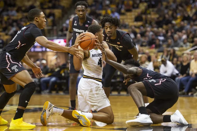Missouri's Javon Pickett, bottom center, looks to pass the ball as he is surrounded by Temple's Nate Pierre-Louis, Shizz Alston Jr., Trey Lowe and De'Vondre Perry, from left, during the first half of an NCAA college basketball game Tuesday.