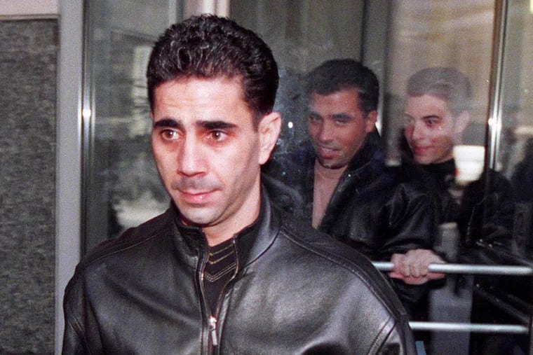 Philadelphia Mob underboss Joey Merlino leaves the Justice Center tuesday afternoon.  An associate Anthony Accardo (at center) walks through revolving door behind  him. Philadelphia Daily News photo by Alex Alvarez
