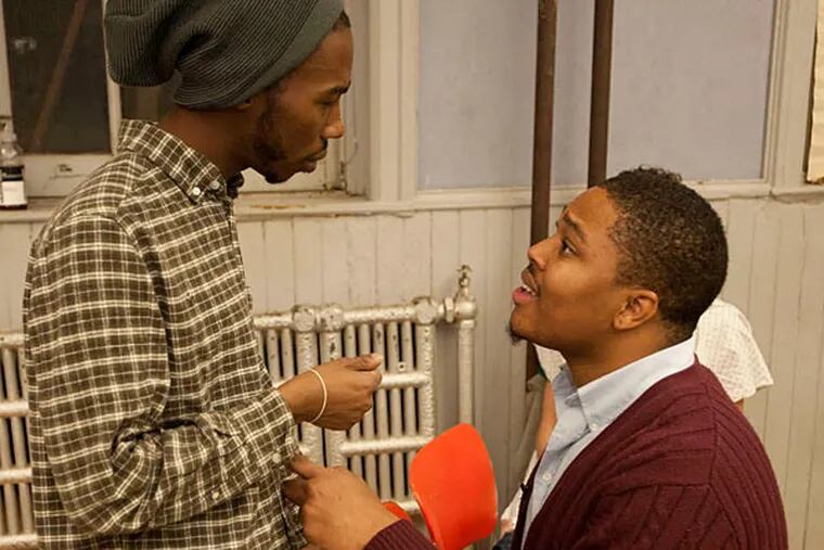 Terrell Brown (left) and Malcolm Kenyatta discuss a scene in &quot;You Gotta Eat Dirt Before You Die&quot; by Kimmika Williams-Witherspoon. (RON TARVER / Staff Photographer)
