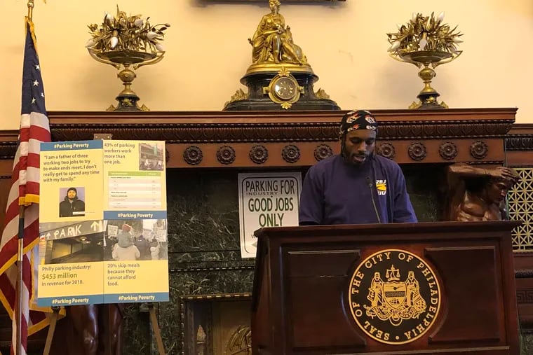 West Philadelphia resident Mike Hardaway speaks about his experience as a parking worker at a City Hall press conference Tuesday.
