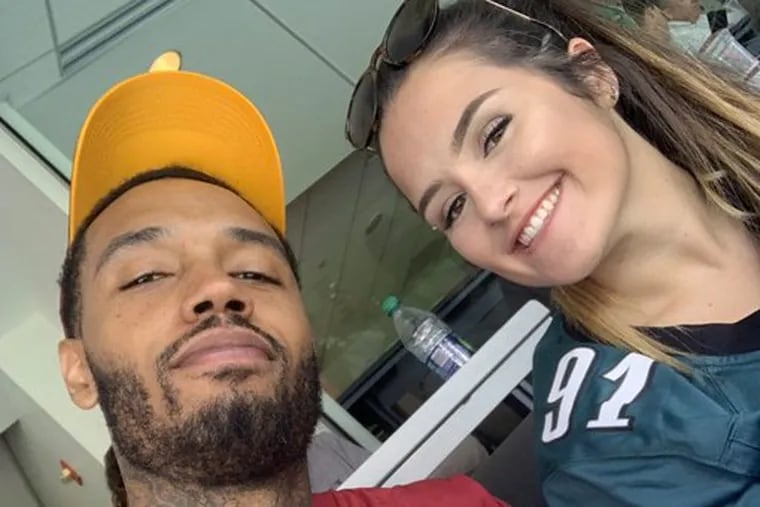 Sixers forward Mike Scott poses for a selfie with Flyers photographer Alex McIntyre at Sunday's Eagles-Redskins game at Lincoln Financial Field.