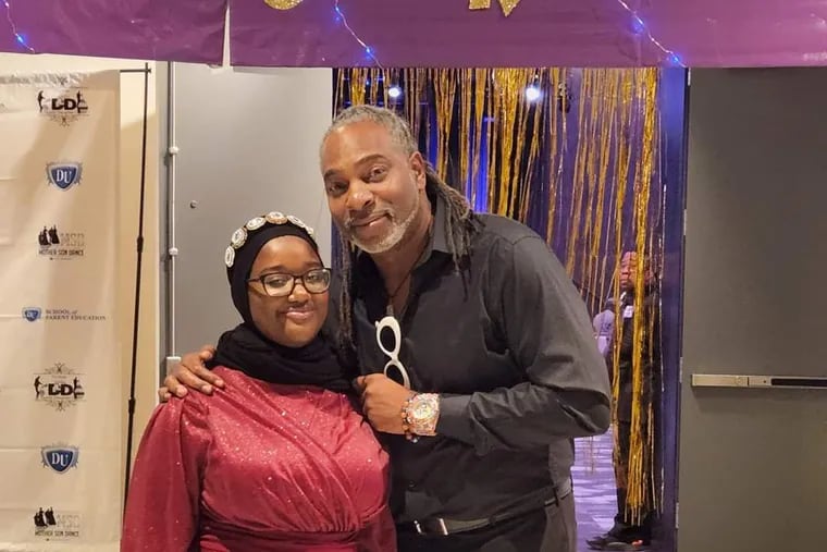 Joel Austin, founder and CEO of Daddy University Inc., poses with his daughter, Maryam Rahman, at the annual Daddy Daughter Dance.
