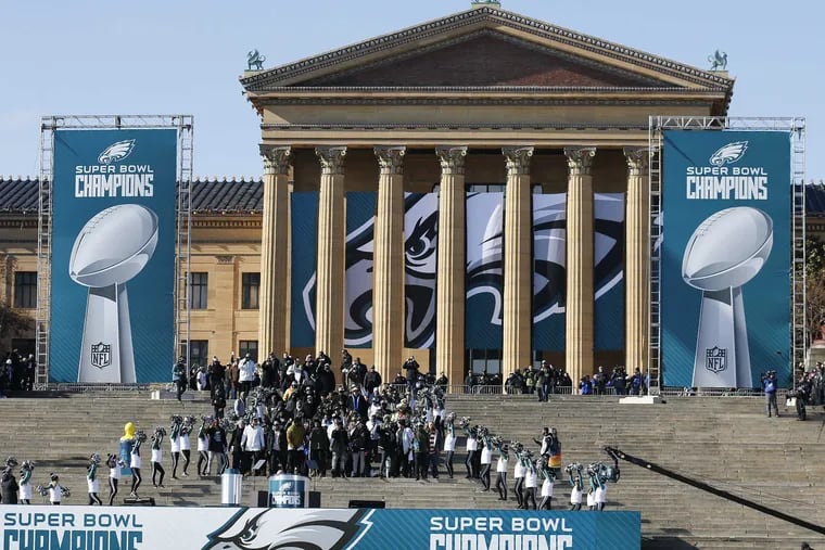 Members of the Eagles march down the steps of the Philadelphia Museum of Art during the Super Bowl LII victory celebration on Feb. 8, 2018.