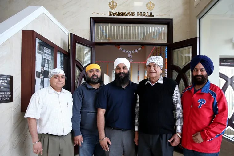 Left, to right: Parminder Singh, Lakhwinder Singh, Tony Rahil, Chhattarpal Singh, and Jagvinder S. Chattha pose at Pine Hill Sikh Gurdwara.