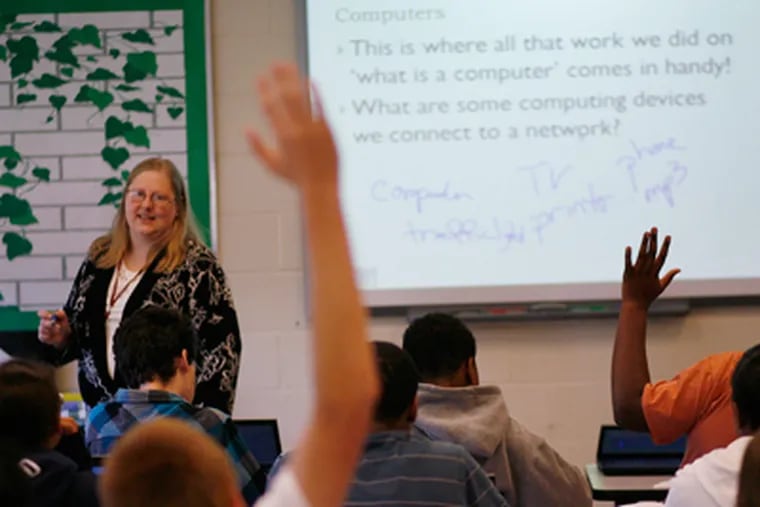 Tammy Pirmann (left), a computer science teacher, talks about networks in her 9th grade class. (Michael S. Wirtz / Staff Photographer)