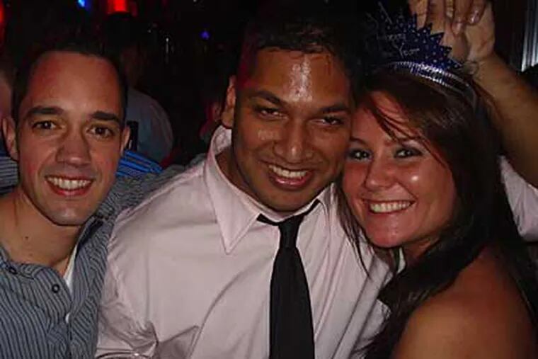Snapshot of David Martinez celebrating with unidentified friends on New Year's Eve.  He was found in a frozen pond outside a nightclub New Year's Day.