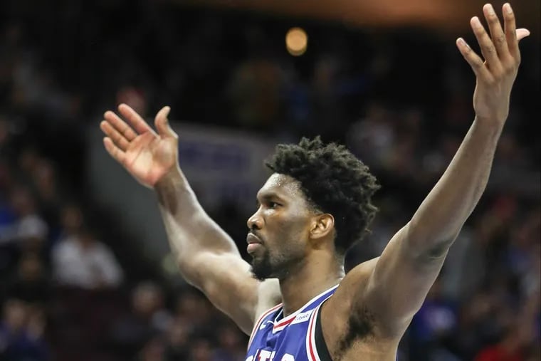 Sixers center Joel Embiid celebrates after his dunk against the Hawks during the fourth quarter of the Sixers’ win on Wednesday.