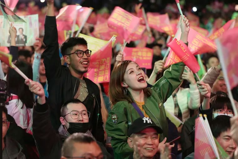 Supporters of Taiwan's 2020 presidential election candidate, Taiwan president Tsai Ing-wen cheer for Tsai's victory in Taipei, Taiwan, Saturday, Jan. 11, 2020.