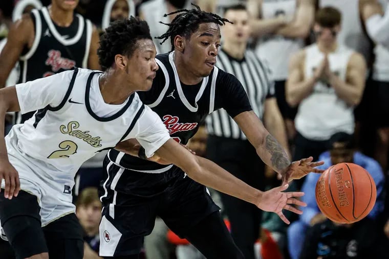 Archbishop Ryan's Darren Williams and Neumann Goretti's Stephon Ashley-Wright try for a loose ball during the fourth quarter of the Catholic League boys' semifinals on Feb. 21.