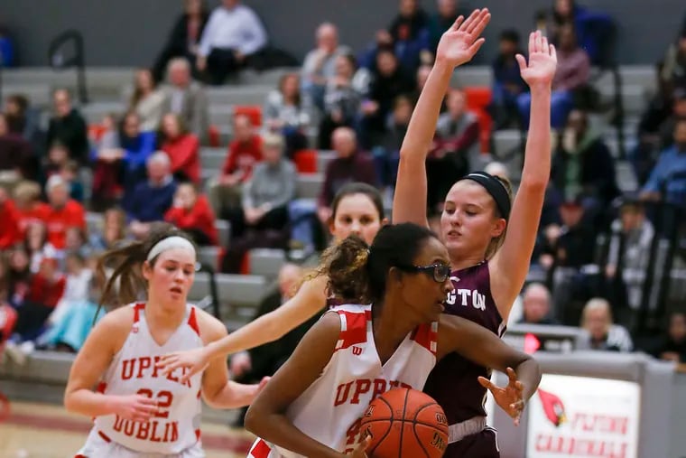 Upper Dublin's Jackie Vargas drives to the basket against Abington's Camryn Lexow in a game in January.