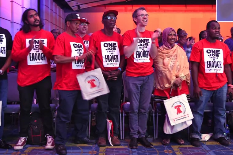 Members of UNITE HERE locals 634 and 274 stand during the opening of the "Workers' Presidential Summit" hosted by the Philadelphia Council of the AFL-CIO at the Convention Center September 17, 2019.