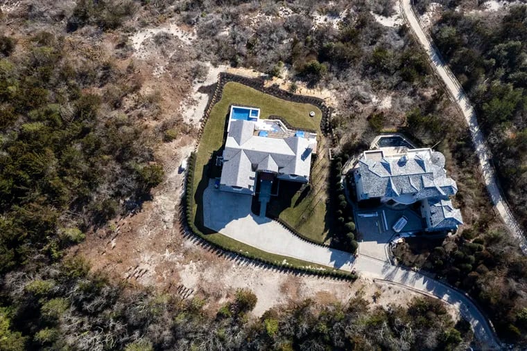 New Jersey has cited the owners of the house (at left) in Avalon's high dunes with violating state restrictions on altering the topography and the landscape in protected areas.