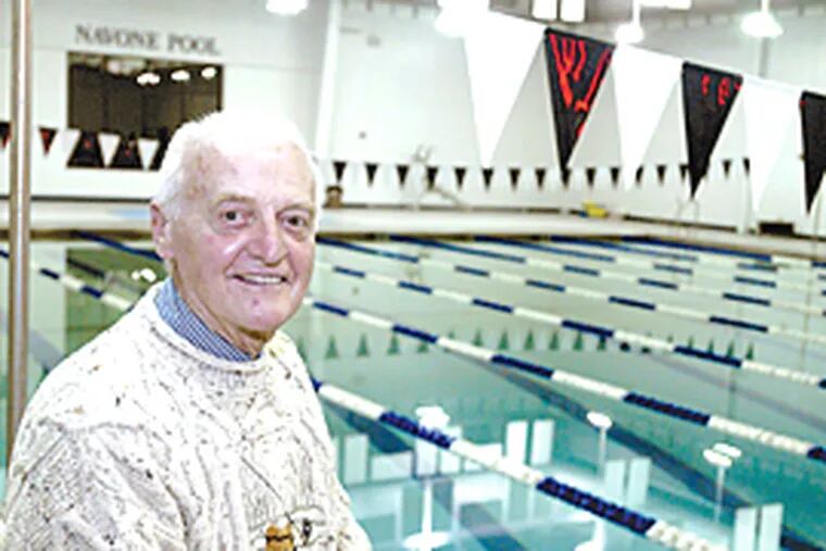 Paul Navone overlooks the pool at St. Augustine Prep School in Richland NJ that is named after him. (Ron Tarver/ Inquirer)