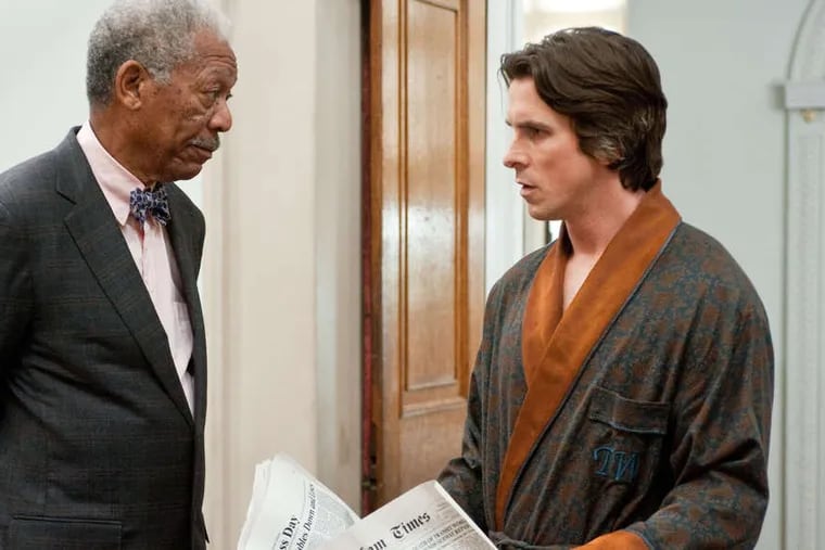 Father figure: Morgan Freeman as Lucius Fox and Christian Bale as Bruce Wayne in &quot;The Dark Knight Rises.&quot;