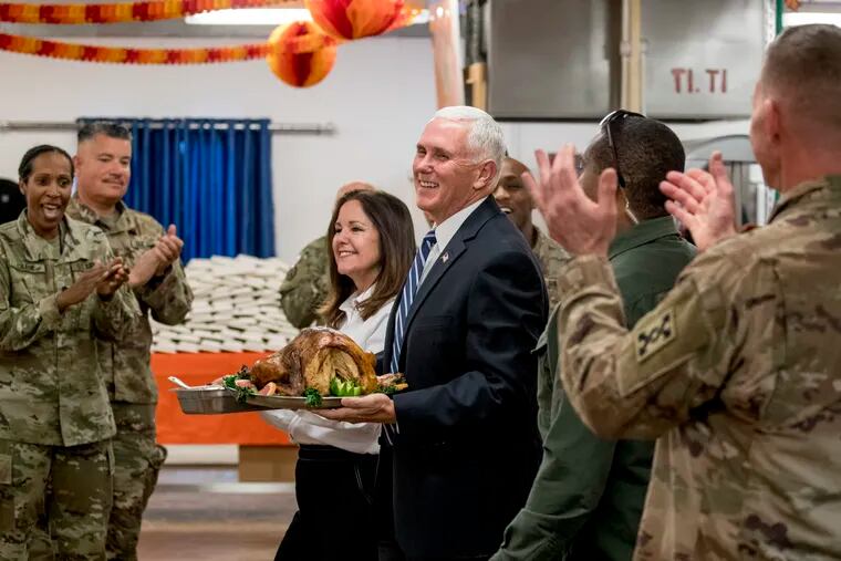 Vice President Mike Pence and his wife Karen Pence arrive with turkey to serve to troops at Al Asad Air Base, Iraq, Saturday, Nov. 23, 2019. The visit is Pence’s first to Iraq and comes nearly one year since President Donald Trump’s surprise visit to the country.